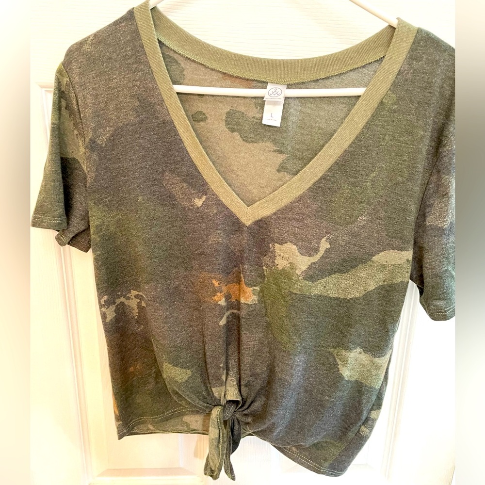 Camo tie front top. Sits above waist